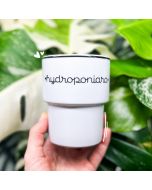 A white mug with the word "Hydroponiara" (meaning a hydroponics girl) on it